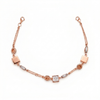 Rose gold bracelet with square and round links on a white background