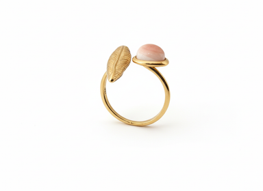 Feather ring with pink coral stone
