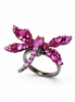 Jewelry ring with pink gemstones on a white background
