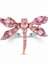 Pink dragonfly-shaped sterling silver ring with gemstones on a white background