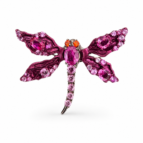 Pink dragonfly-shaped ring with gemstones on a white background