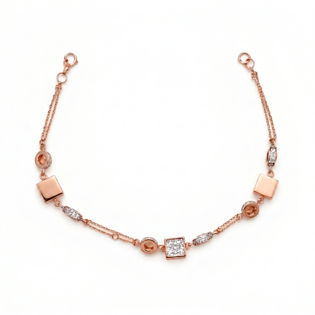 Rose gold bracelet with square and round links on a white background