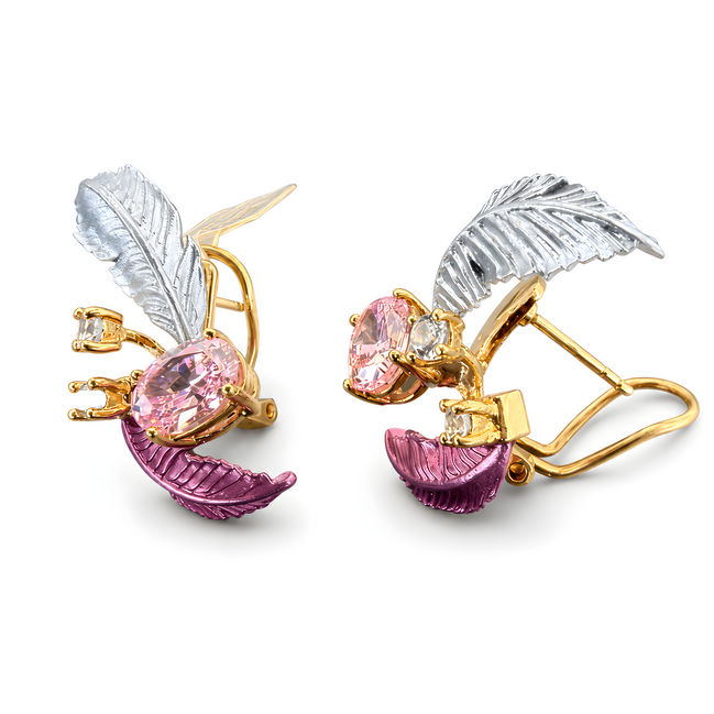 Earrings with pink gemstones, silver and gold leaves on a white background