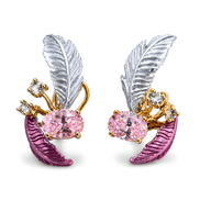 Pair of feather-shaped earrings with pink gemstones and gold accents on a white background