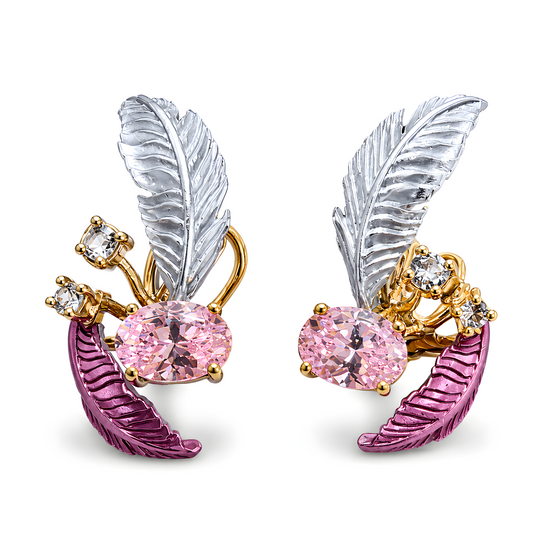 Pair of feather-shaped earrings with pink gemstones and gold accents on a white background