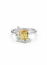Ring with a yellow gemstone and cubic zirconia accents on a white background