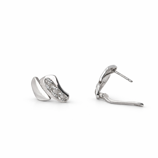 Pair of silver earrings on a white background - side view of the closure.