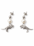 Pair of earrings with dinosaur charms and pearl beads on a white background