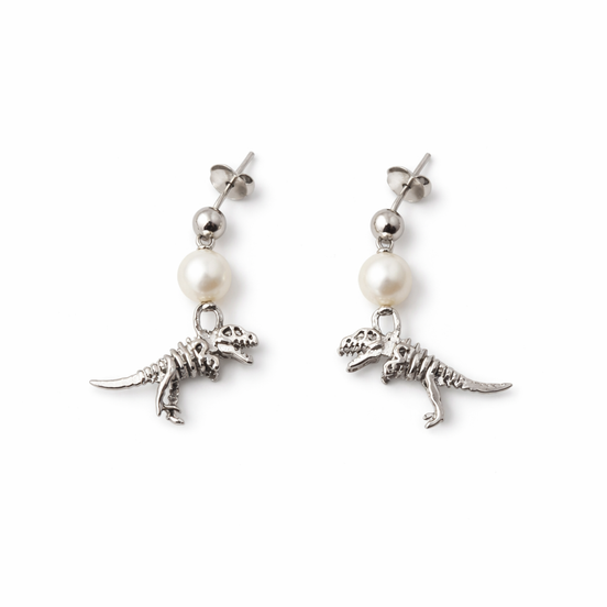 Pair of earrings with dinosaur charms and pearl beads on a white background
