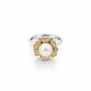 Silver ring with a pearl and gold accents on a white background