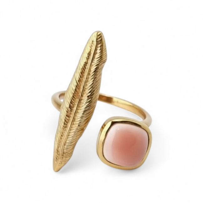 Feather ring with pink coral stone