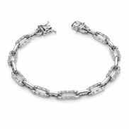 Silver bracelet with clear gemstones on a white background
