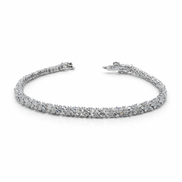 Silver bracelet with clear stones on a white background